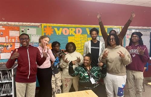  RHS Students and teacher posing in classroom